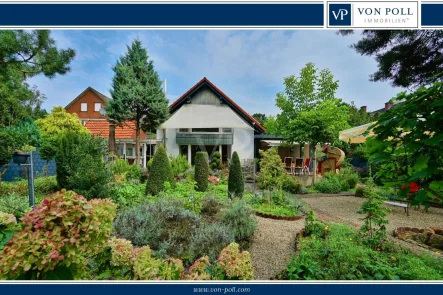 Titelbild - Haus kaufen in Ibbenbüren - Flexible Nutzungsmöglichkeiten- drei Wohneinheiten mit traumhaften Garten in Ibbenbüren