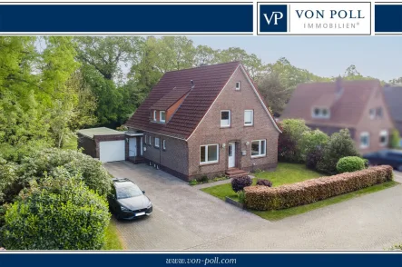 Titelbild - Haus kaufen in Aurich / Haxtum - Zweifamilienhaus mit Baugrundstück in begehrter Lage von Aurich