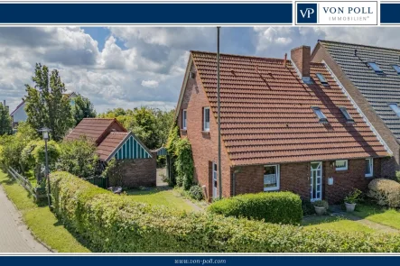 Ansicht - Haus kaufen in Langeoog - Doppelhaushälfte mit Blick über die Felder von Langeoog