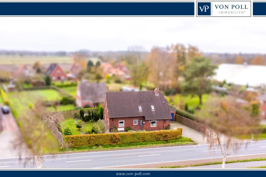 Titelbild - Haus kaufen in Stedesdorf - Geräumiges Einfamilienhaus mit Einliegerwohnung und Garten in Esens.