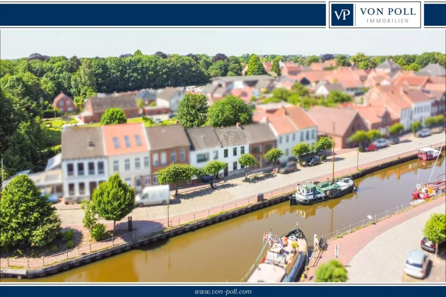 Titel - Haus kaufen in Weener - Denkmal am Hafen von Weener - Wohnen mit Blick aufs Wasser