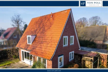 Titelbild - Haus mieten in Wittmund - Modernisiertes Einfamilienhaus mit Garten und Garage in zentraler Lage von Wittmund!