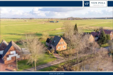 Weitsicht - Haus kaufen in Hinte / Canhusen - Weitblick! Einfamilienhaus mit massivem Nebengbäude in ruhiger Lage