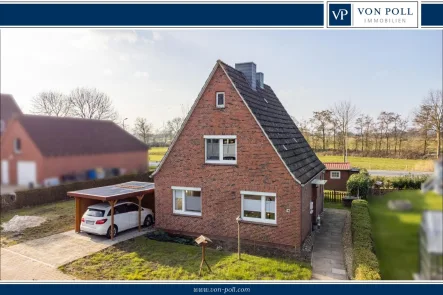 Titelbild - Haus kaufen in Hinte - Ihr Rückzugsort in Hinte – Mit Carport & liebevollen Details