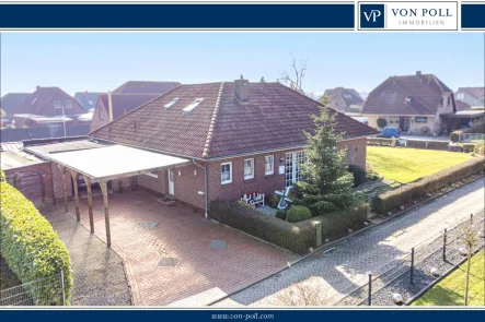  - Haus kaufen in Krummhörn / Grimersum - Modernisiert & ruhig gelegen – Winkelbungalow mit PV-Anlage