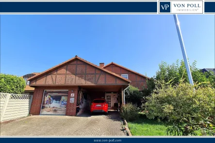 Titelbild - Haus kaufen in Bremervörde / Iselersheim - Großzügiges Haus mit Pool, Sauna und Wintergarten in ruhiger Lage