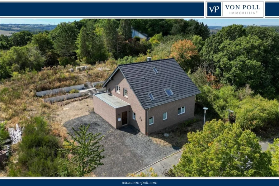 Straßenansicht - Haus kaufen in Bad Münstereifel - Ab sofort mit größerem Grundstück! Hochwertiges Einfamilienhaus mit der Energieeffiziensklasse A+ in Rodert