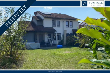 Titelbild - Haus kaufen in Schweinfurt - RESERVIERT Modernisierte DHH mit PV-Anlage und Speicher in familienfreundlichem Wohngebiet