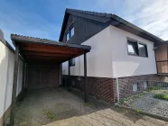 Ostseite mit Carport und Garage