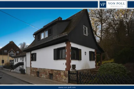 Titelbild - Haus kaufen in Taunusstein / Wingsbach - Sanierungsbedürftige Immobilie mit tollem Grundstück