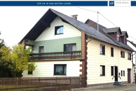 Titelbild - Haus kaufen in Ulrichstein - Raumwunder für die ganze Familie