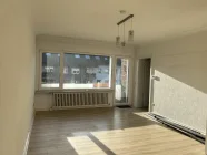 Wohnzimmer mit Balkon