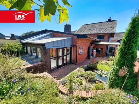 Rückansicht - Haus kaufen in Bedburg - Bedburg-Grottenherten! DHH mit Anbau, Wintergarten und sonnigem Grundstück!