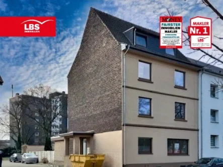 Hausansicht - Haus kaufen in Dinslaken - Wohnhaus als Kapitalanlage mit 130 m² großer Erdgeschosswohnung! 