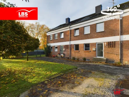 Außenansicht - Haus kaufen in Ennigerloh - Familienfreundliches Reihenhaus mit 2 Garagen!