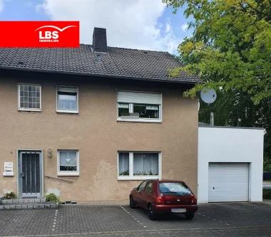 Haus Vorderansicht - Haus kaufen in Ahlen - Interessantes Zweifamilienhaus für Kapitalanleger oder Selbstnutzer!