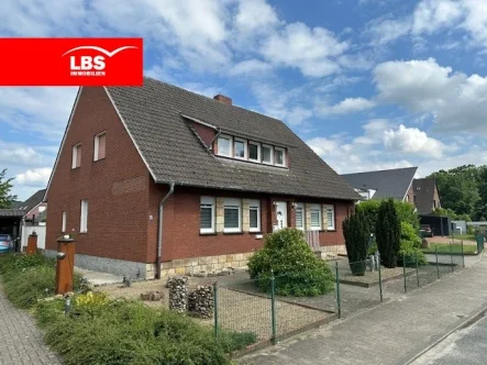 Straßenansicht - Haus kaufen in Hörstel - Hörstel! Einfamilienhaus mit großem Grundstück