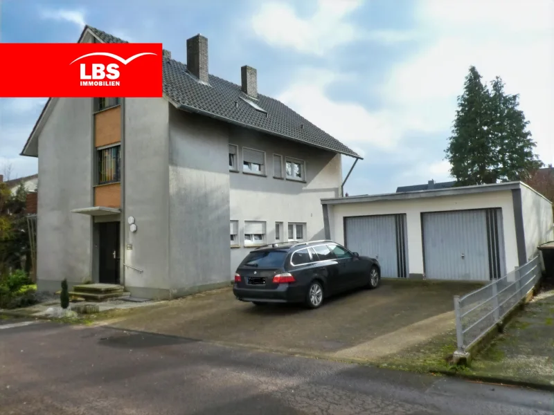 57505611-Straßenansicht - Haus kaufen in Bünde - Solides Zweifamilienhaus mit Potential!