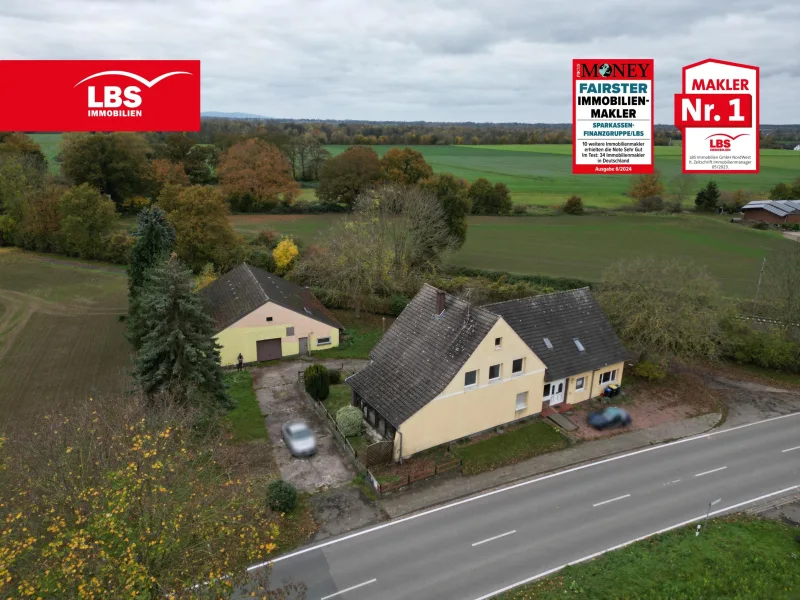 Straßenansicht - Haus kaufen in Petershagen - Ein- bis Dreifamilienhaus mit Gerätelager wartet auf den passenden Handwerker...