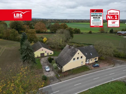 Straßenansicht - Haus kaufen in Petershagen - Ein- bis Dreifamilienhaus mit Gerätelager wartet auf den passenden Handwerker...