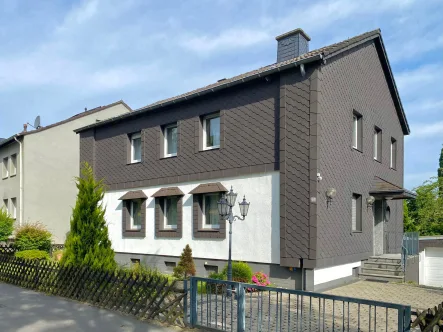 Haus Straßenansicht - Haus kaufen in Dortmund - Ein-/Zweifamilienhaus mit Gartenidylle und tollen Nutzungsmöglichkeiten