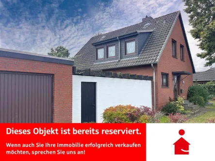 Außenansicht - Haus kaufen in Delmenhorst - Einfamilienhaus mit Doppelgarage in beliebter Wohnlage 