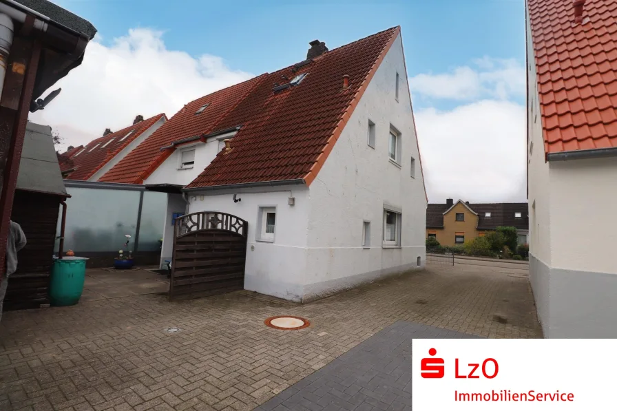  - Haus kaufen in Delmenhorst - Charmante Doppelhaushälfte mit Carport und großem Garten