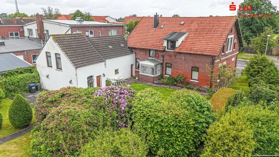 Luftaufnahme - Haus kaufen in Butjadingen - Wohn- und Geschäftshaus (Denkmalschutz) in guter Lage