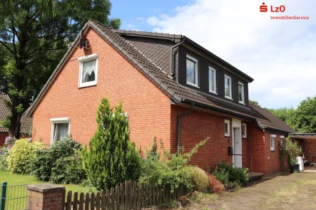 Gemütliches Siedlungshaus mit großem Grundstück - Haus kaufen in Hude - Siedlungshaus mit Potential auf großem Grundstück