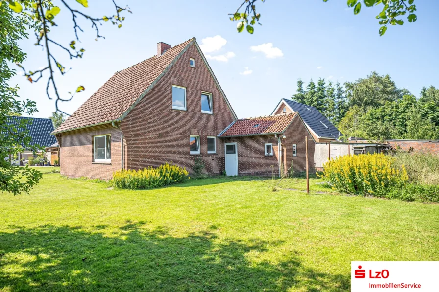 Außenansicht - Haus kaufen in Ovelgönne - Wieder verfügbar! Freier Blick über die Felder der Wesermarsch