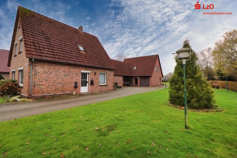 Außenansicht - Haus kaufen in Edewecht - Wohnnhaus mit Einliegerwohnung und Nebengebäude 