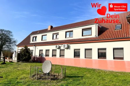 Gartenansicht - Haus kaufen in Schiffdorf - Große Wohnung / Einfamilienhaus in Geestenseth