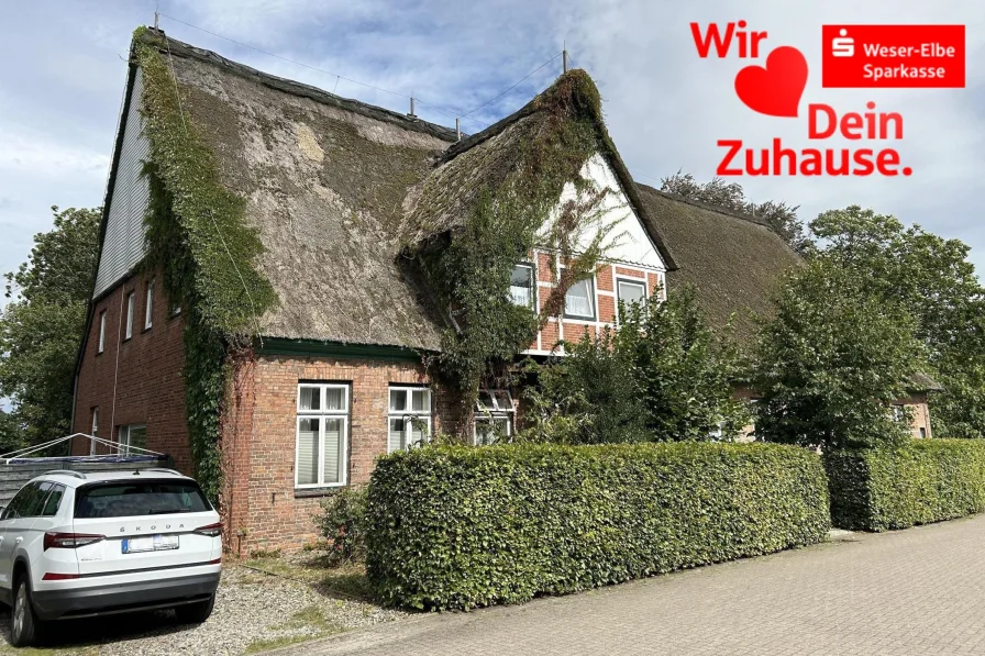 Frontansicht links - Haus kaufen in Cadenberge - Mehrfamilienhaus mit Gewerbe zentral in Cadenberge