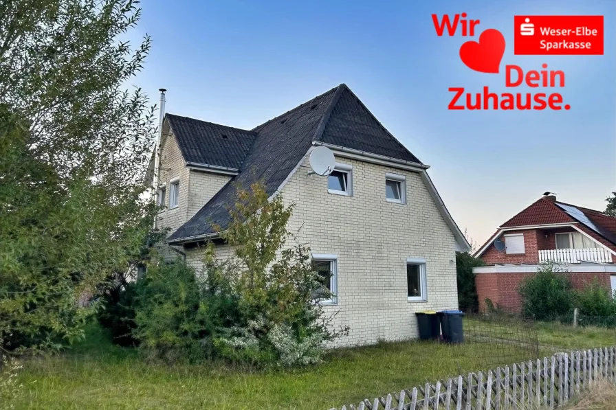 Straßenansicht - Haus kaufen in Schiffdorf - Einfamilienhaus mit Weideland in Wehdel