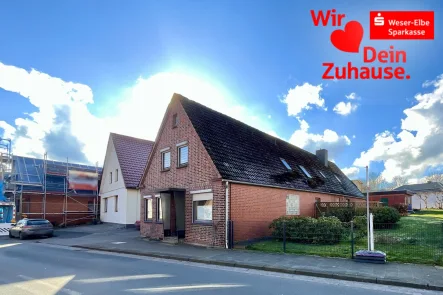 Titelbild - Haus kaufen in Geestland - Zweifamilienhaus im schönen Bederkesa