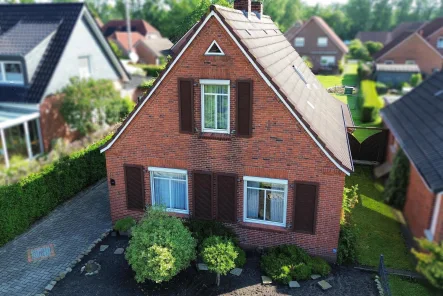 Straßenfront - Haus kaufen in Bunde - Kleine, gemütliche Immobilie in zentraler Lage