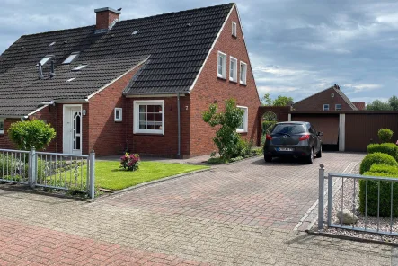 Hausansicht - Haus kaufen in Wittmund - Topgepflegte Immobilie - kurzfristig bezugsfrei!