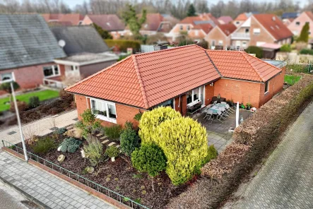 Straßenfront - Haus kaufen in Bunde - Gemütlicher Bungalow in zentraler Lage von Bunde