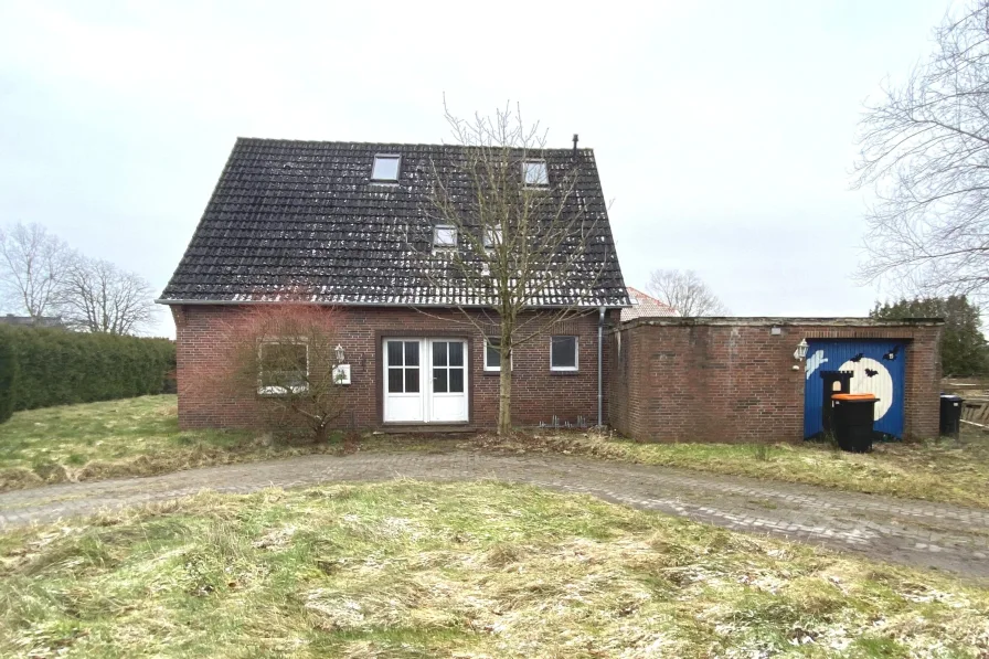  - Haus kaufen in Wittmund - Zwangsversteigerung - Einfamilienhaus mit Garage in Burhafe