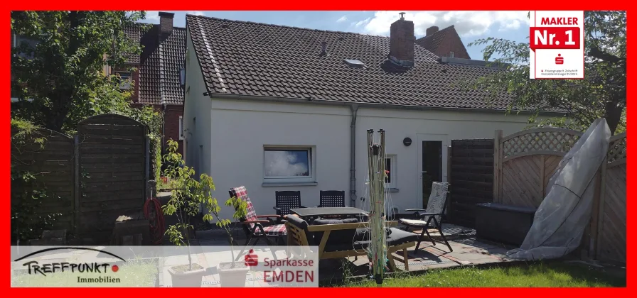 Hausrückseite mit Terrasse und Garten - Haus kaufen in Emden - Vermietetes Einfamilienhaus in toller Lage!