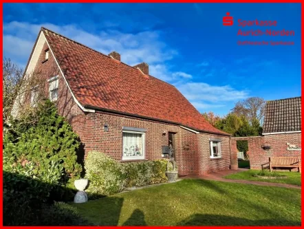 Straßenansicht - Haus kaufen in Südbrookmerland - Gepflegtes Einfamilienhaus in zentraler Lage von Moordorf