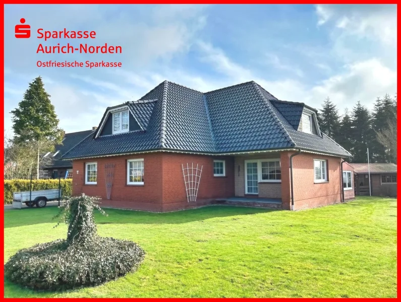 Straßenansicht - Haus kaufen in Südbrookmerland - Energetisch sanierter Bungalow mit großem Grundstück in Moorhusen