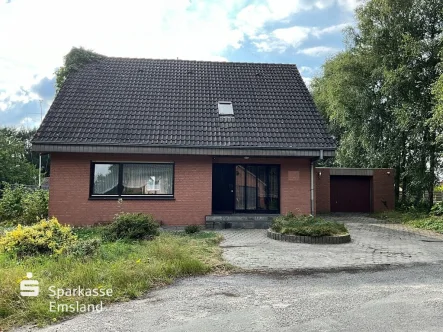 Straßenansicht - Haus kaufen in Twist - Familienzuhause sucht NeubezugEinfamilienhaus in Twist-Siedlung 