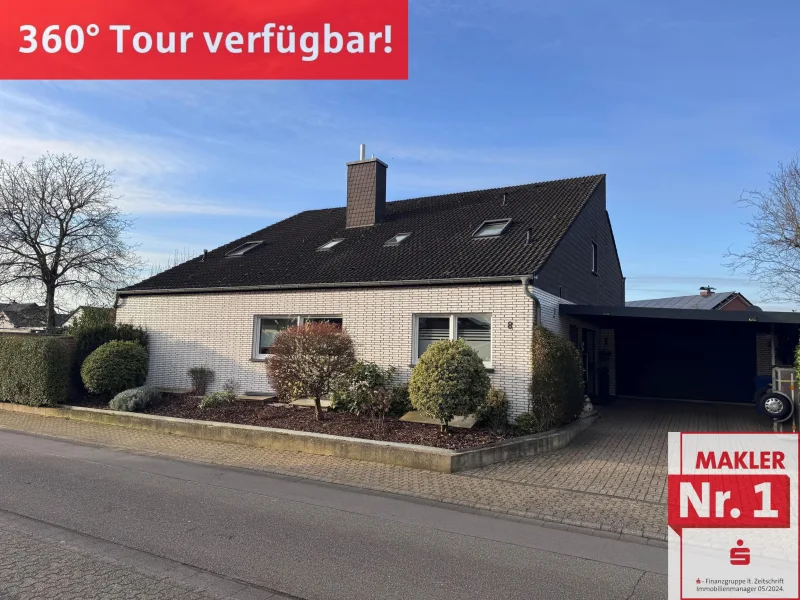 Straßenansicht - Haus kaufen in Hamminkeln - Ein tolles Einfamilienhaus mit einer Einliegerwohnung und großer Garage 