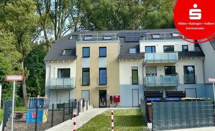 Vorderansicht - Wohnung kaufen in Hilden - Energiesparende Maisonettewohnung mit eigenem Garten!