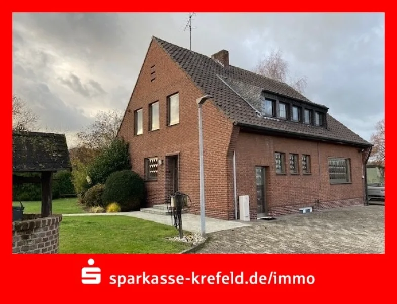 Frontansicht - Haus kaufen in Wachtendonk - Freistehendes Einfamilienhaus mit Garage