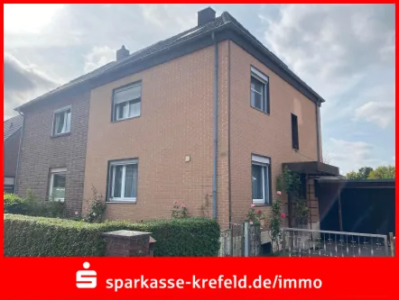 Straßenansicht - Haus kaufen in Tönisvorst - Doppelhaushälfte mit Garage