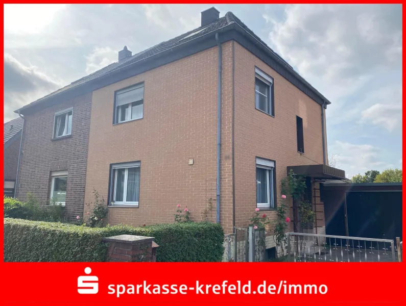 Straßenansicht - Haus kaufen in Tönisvorst - Doppelhaushälfte mit Garage