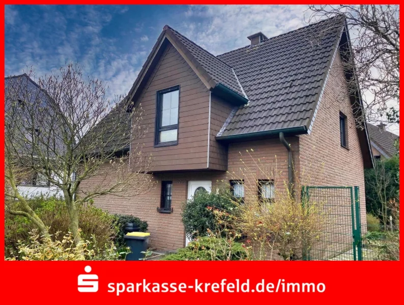 Straßenansicht - Haus kaufen in Tönisvorst - Freistehendes Einfamilienhaus mit Garage