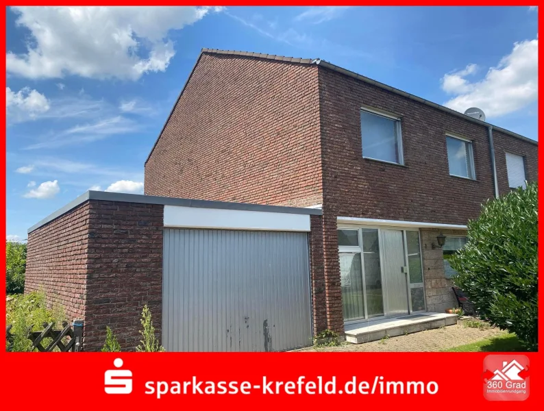 Straßenansicht - Haus kaufen in Tönisvorst - Reihenendhaus mit Garage